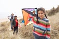 Family Having Fun With Kite In Sand Dunes Royalty Free Stock Photo
