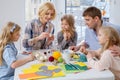 Family having fun painting and decorating easter eggs. Royalty Free Stock Photo