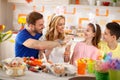 Family having fun while painting Easter eggs Royalty Free Stock Photo