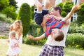 Family Having Fun Playing In Garden Royalty Free Stock Photo