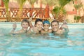 Family having fun in pool Royalty Free Stock Photo