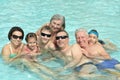 Family having fun in pool Royalty Free Stock Photo