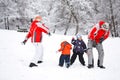 Family having fun in snow Royalty Free Stock Photo