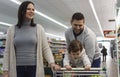 Family having fun in the supermarket Royalty Free Stock Photo