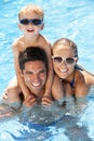 Family Having Fun In Swimming Pool Royalty Free Stock Photo