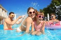 Family having fun in swimming pool Royalty Free Stock Photo