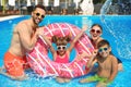 Family having fun in swimming pool Royalty Free Stock Photo