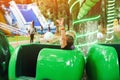 Family having fun together at an amusement park. Summer vacations. Roller coaster ride. Child screaming with joy in amusement park Royalty Free Stock Photo