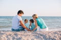 Family having fun on tropical beach