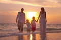 Family having fun on vacation with perfect sunset