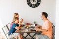 Family having lunch on the balcony with sea view Royalty Free Stock Photo