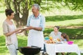 Family having lunch in the lawn Royalty Free Stock Photo