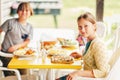 Family having lunch outside on a terrace Royalty Free Stock Photo