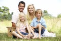 Family having picnic in countryside Royalty Free Stock Photo