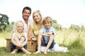 Family having picnic in countryside Royalty Free Stock Photo