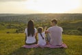 Family having picnic on green meadow in summer Royalty Free Stock Photo