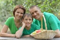 Family having picnic in summer park Royalty Free Stock Photo