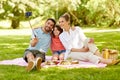 Family having picnic and taking selfie at park