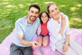 Family having picnic and taking selfie at park