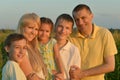 Family having rest in field