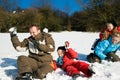 Family having a snowball fight Royalty Free Stock Photo