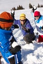 Family Having Snowball Fight On Ski Holiday Royalty Free Stock Photo