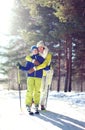 Family healthy lifestyle! Mother and son go skiing in the woods