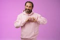 Family in heart. Portrait lovely handsome romantic bearded man in pink hoodie passionatly looking camera show love
