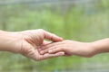 Family helping - Child hand put on mother hand with love and care