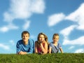 Family on herb under blue sky Royalty Free Stock Photo