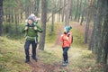 Family on a hike in the forest with baby in child carrier Royalty Free Stock Photo