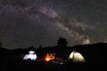 Family hikers having a rest at night camping in mountains Royalty Free Stock Photo