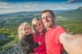 Family hikers making selfie mountain valley background