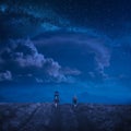 Family hikers under the starry sky