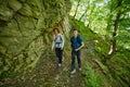 Family of hikers walking on a mountain trail Royalty Free Stock Photo