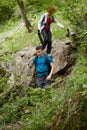 Family of hikers walking on a mountain trail Royalty Free Stock Photo