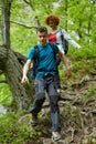 Family of hikers walking on a mountain trail Royalty Free Stock Photo