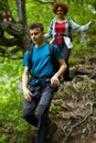 Family of hikers walking on a mountain trail Royalty Free Stock Photo