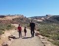 Family hiking at Arches NP Delicate Arch trail