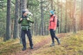 Family hiking in the forest with baby in child carrier Royalty Free Stock Photo