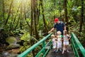 Family hiking in jungle. Royalty Free Stock Photo