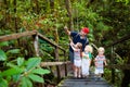 Family hiking in jungle. Royalty Free Stock Photo
