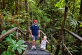 Family hiking in jungle. Royalty Free Stock Photo