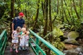 Family hiking in jungle. Royalty Free Stock Photo