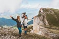 Family hiking in mountains couple man and woman traveling with child adventure