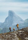 Family hiking in Norway mountains, active vacations with backpack outdoor. Parents and child traveling together Royalty Free Stock Photo