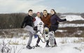 family hiking with snowshoes racket in winter day