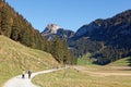 Tourists hiking in sunny, last summer days, Appenzeller SÃÂ¤mtis valley