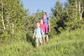 Family hiking together in a mountain forest Royalty Free Stock Photo