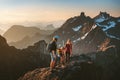 Family hiking together travel in Norway mountains: parents and child outdoor climbing adventure healthy lifestyle Royalty Free Stock Photo